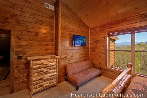 Large Pigeon Forge cabin rental with 8 bedrooms with private bath, futon and mountain views.