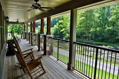 deck of a cabin by the river
