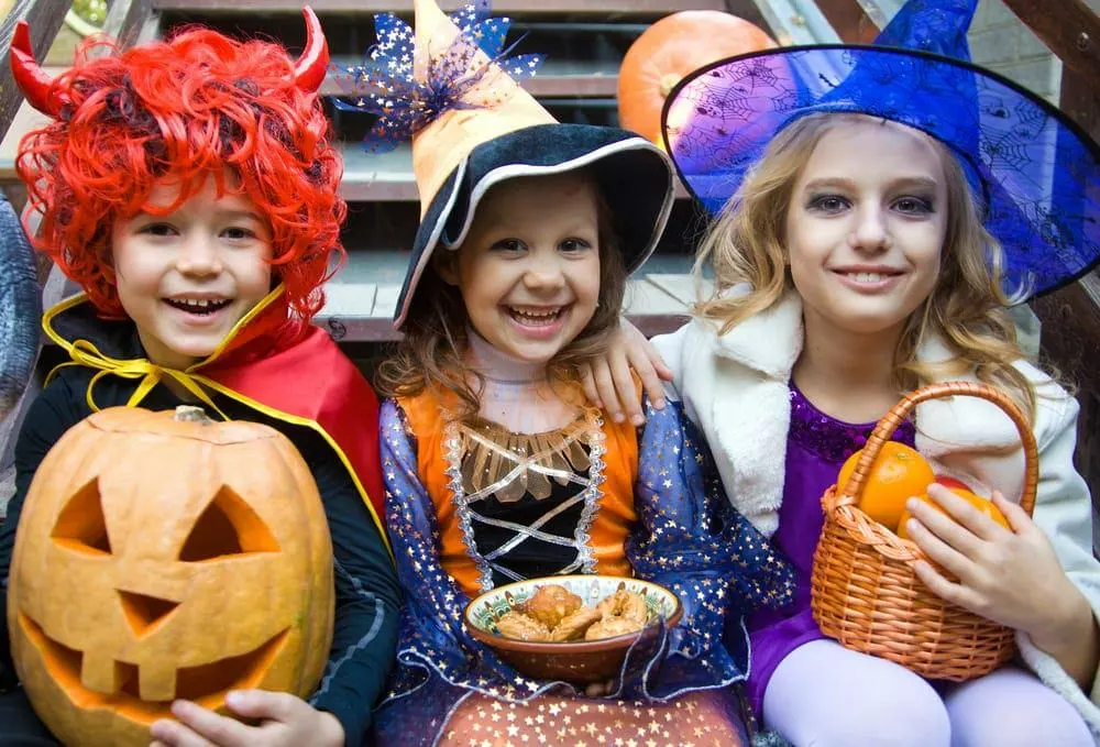 Kids trick or treating in Halloween costumes