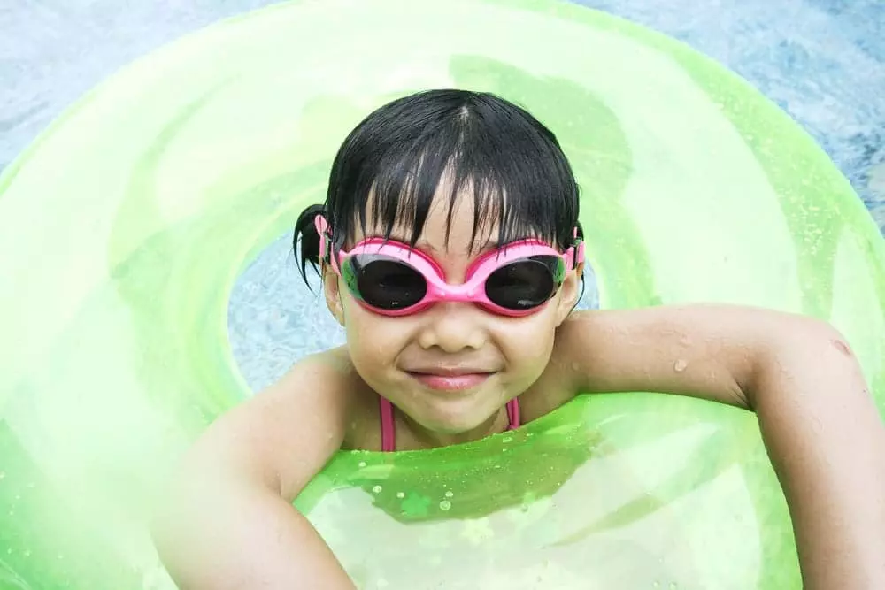 Girl enjoying staying in a cabin in Gatlinburg with pool access