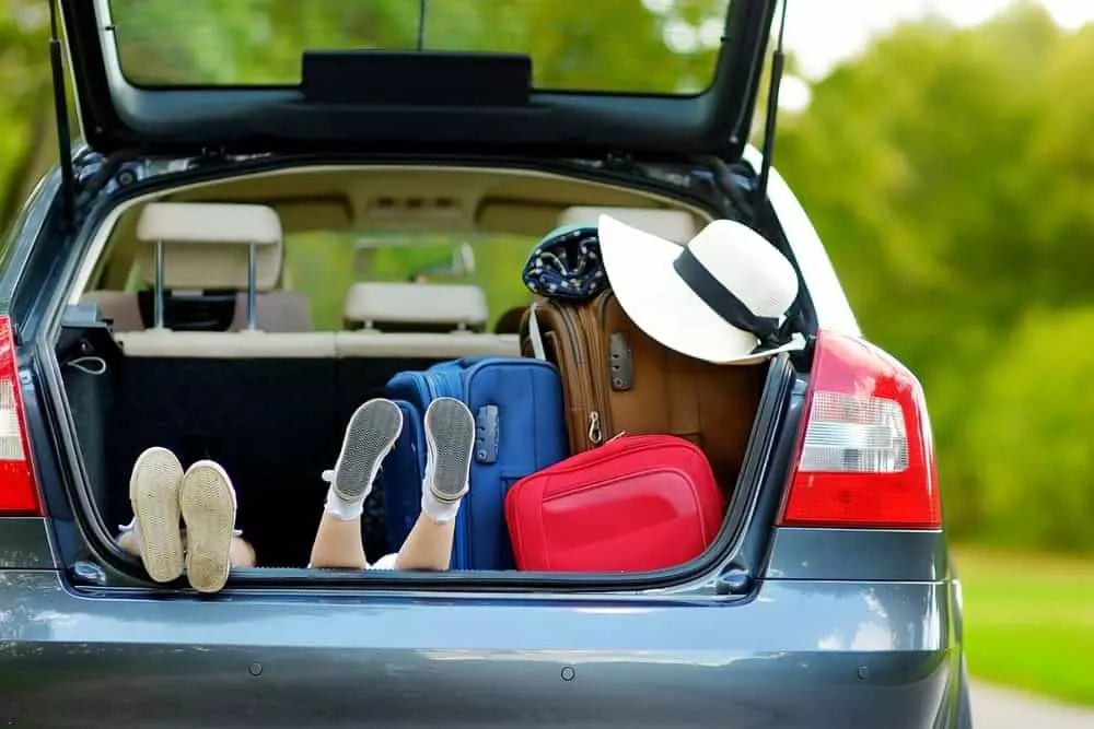 Two girls sitting in the car waiting to go on vacation