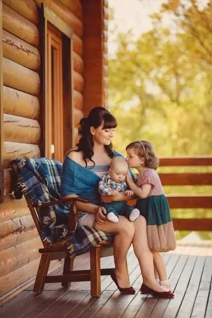 Mom and kids at a Gatlinburg cabin during fall in the Smoky Mountains.