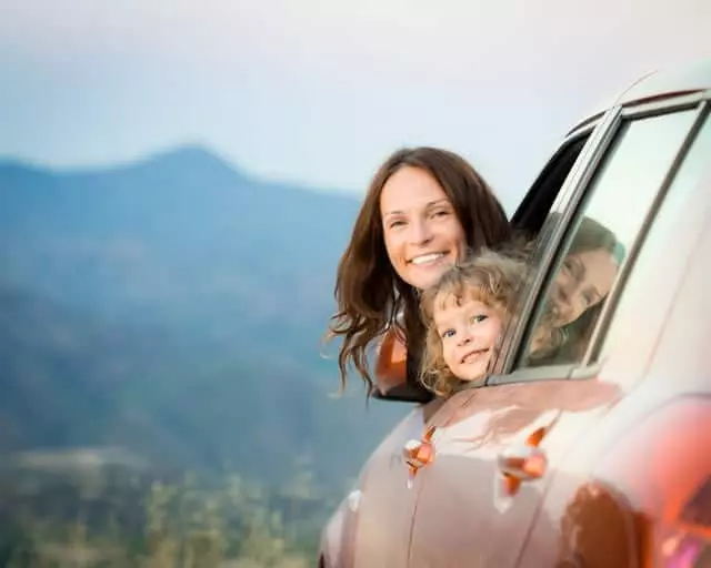 family in the car on the way to a Gatlinburg cabin vacaiton