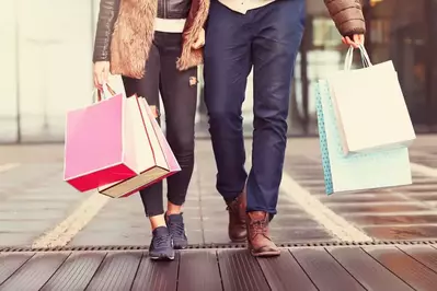 people walking with shopping bags