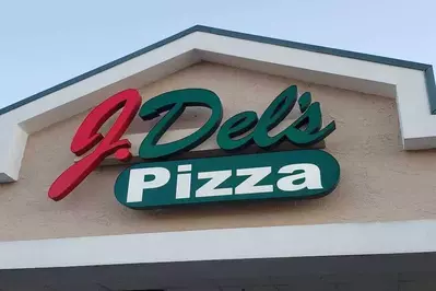 J. Dels pizza sign