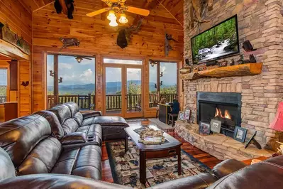 living room in Smoky Mountain cabin with fireplace and views
