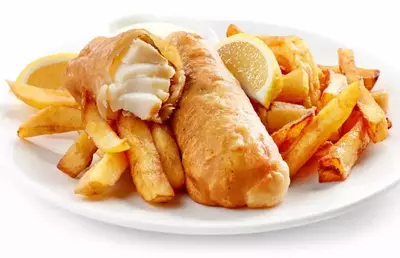 fish and chips with lemon wedges