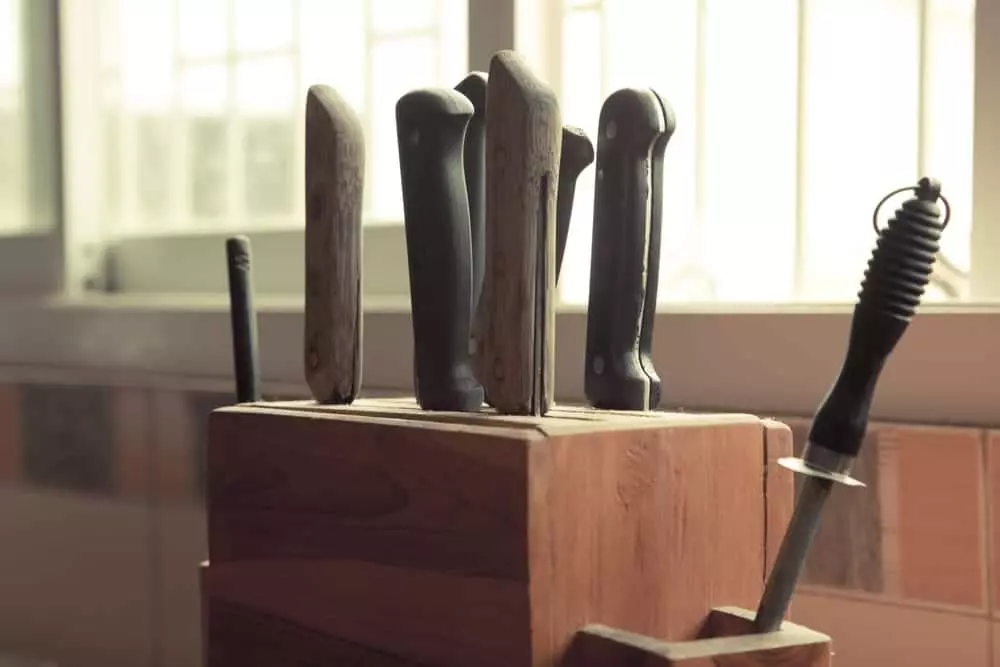 knives in a knife block in a kitchen