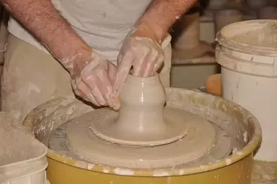 potter making dishes