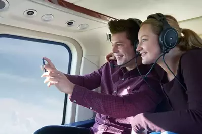 couple taking a scenic helicopter tour in pigeon forge