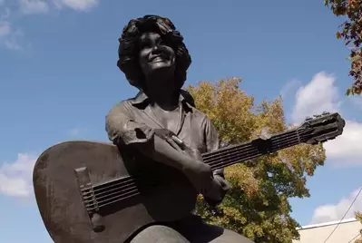 A statue of Dolly Parton in the Smoky Mountains.