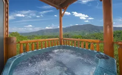 Hot tub on the incredibly scenic deck of the Mountain Breeze Manor cabin.