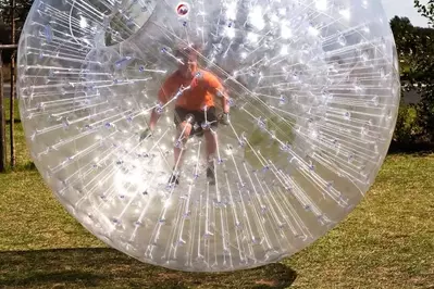 A boy in a Zorb.