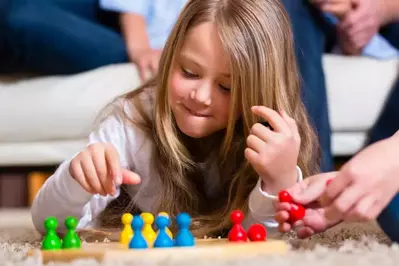 Girl playing board games