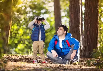 Father and son on a hike in the woods near our log cabin rentals in the Smoky Mountains.