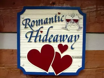 omantic hideaway cabin in gatlinburg sign