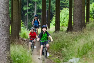 Family on a bike ride near our secluded luxury cabins in Pigeon Forge.