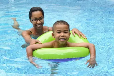 Sibling having fun at our Smoky Mountain cabins with pool access.