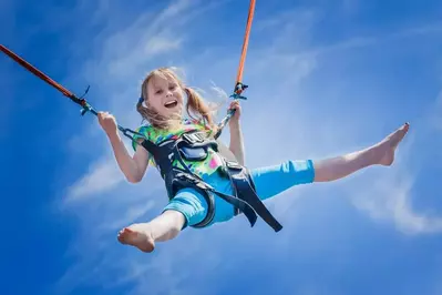 little girl bungee jumping at The Track in Pigeon Forge