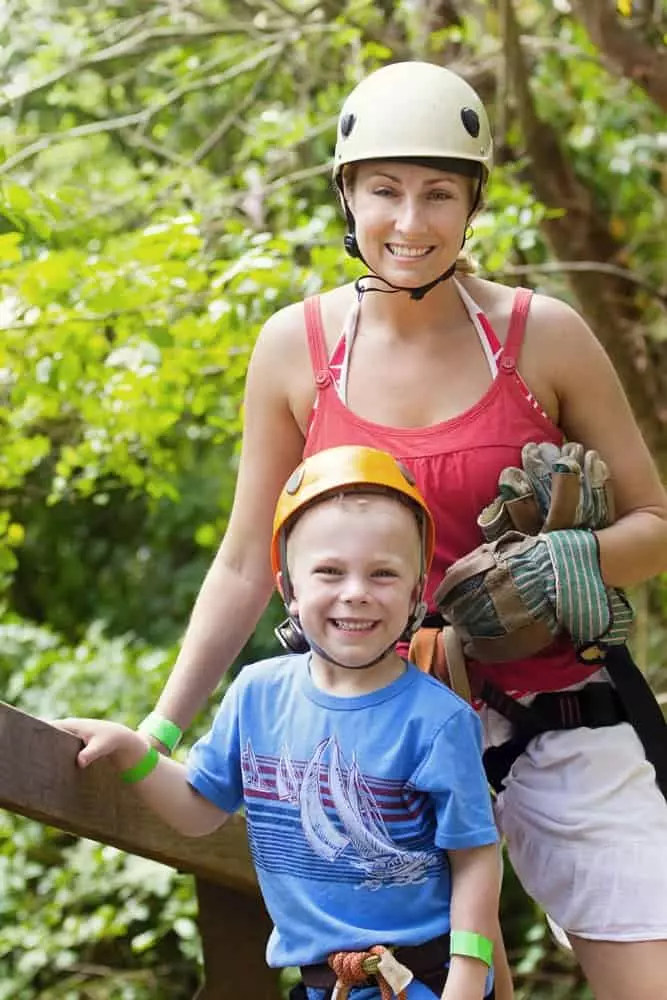 Mom and son preparing to go ziplining, one of the most popular things to do in Pigeon Forge in the summer.