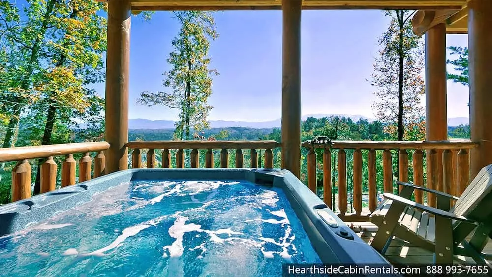 The hot tub and porch with an incredible view at a 3 bedroom Pigeon Forge cabin.