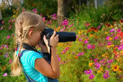 little girl taking pictures during a Pigeon Forge family vacation