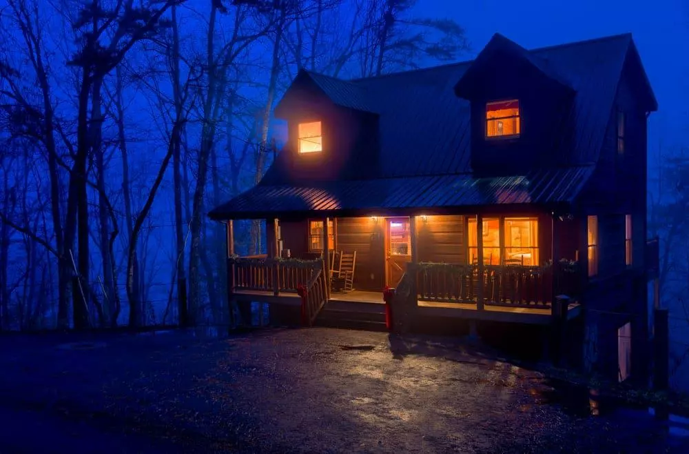 view of secluded Pigeon Forge cabin at night