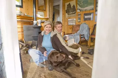 Dog and owners relaxing at Pet Friendly Smoky Mountain Cabin