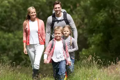 Family hiking during stay at a Gatlinburg Luxury Cabin for Easter