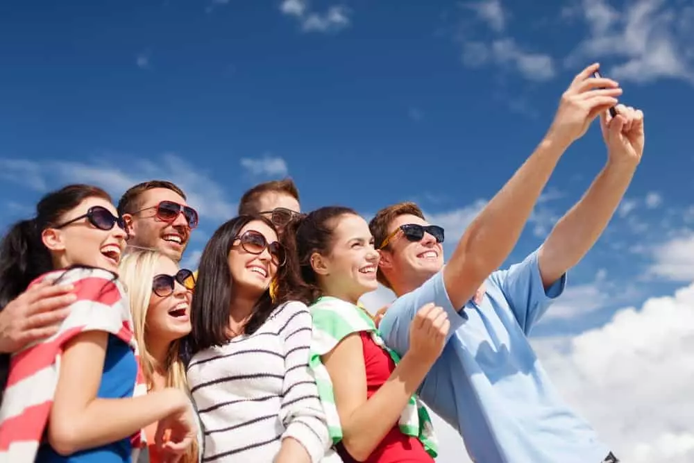 Group of young adults taking a group selfie