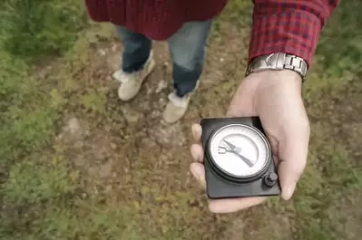 man holding compass while hiking in the Smoky Mountains