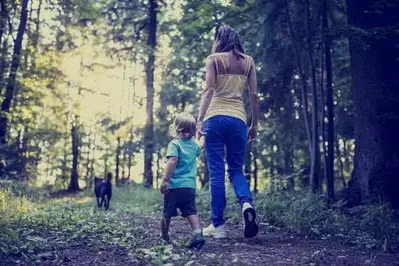 mother and son hiking in the Smokies with a dog