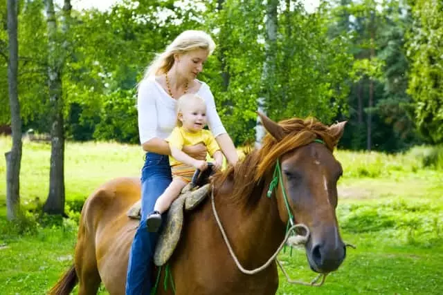mom and baby horseback riding