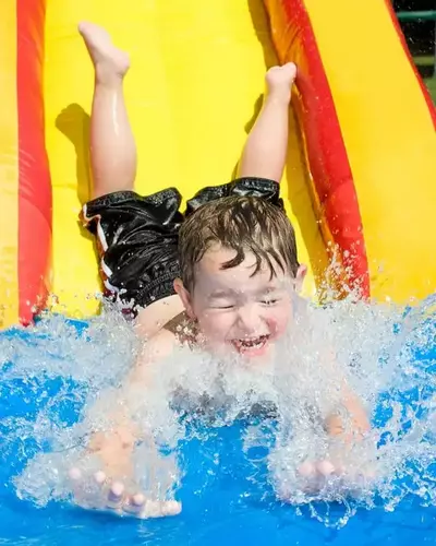 kid on water slide