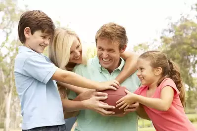 Family playing football