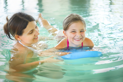 Mom and Daughter with pool toy Pigeon Forge cabin with indoor pool