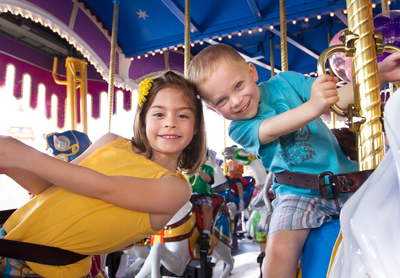 kids enjoying merry go round dueing Pigeon Forge family vacation