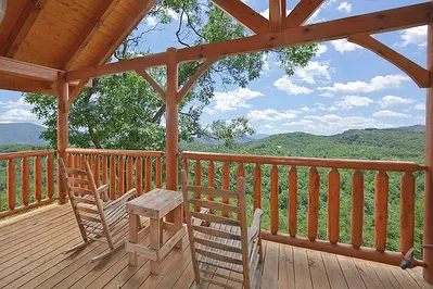 Two chairs on the deck of one of Time Well Wasted, our romantic Smoky Mountain cabins.