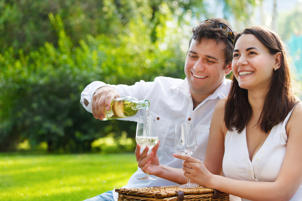 Couple enjoying a glass of wine near our romantic Smoky Mountain cabins.