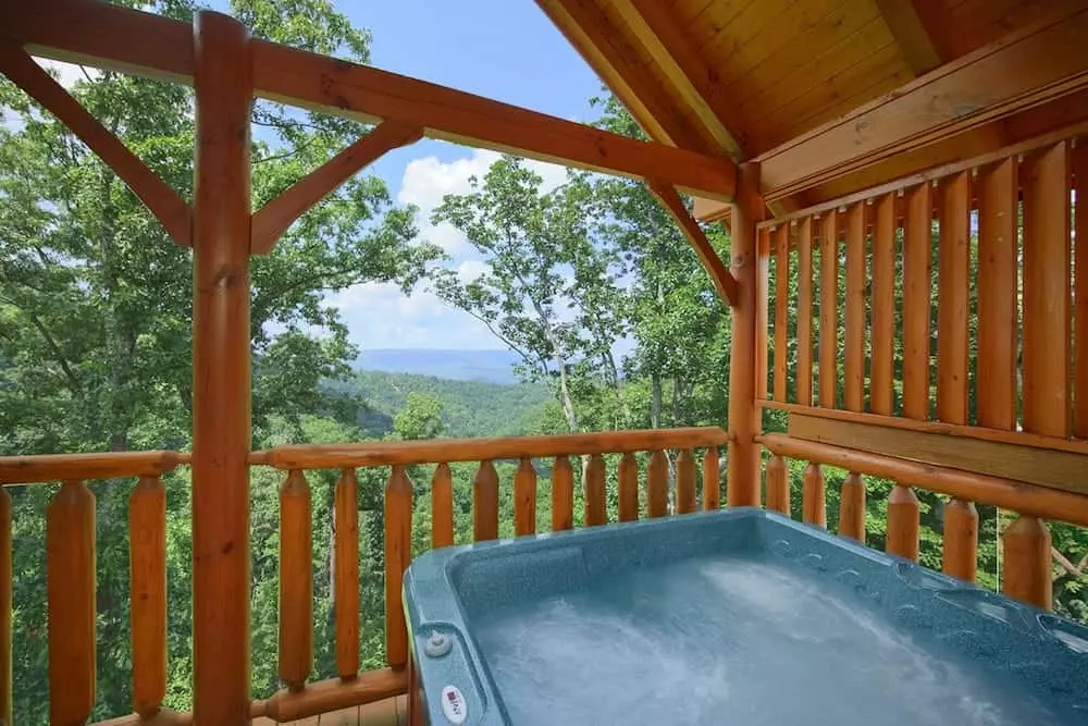 Hot tub on the deck of the High Timber Retreat cabin