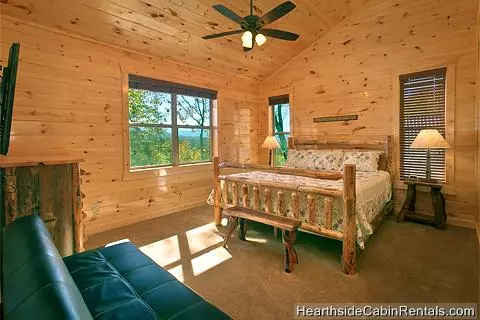 King bedroom with mountain view at A Grand View Lodge cabin in Pigeon Forge