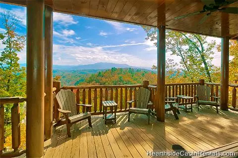 Pigeon Forge cabin with covered deck and chairs