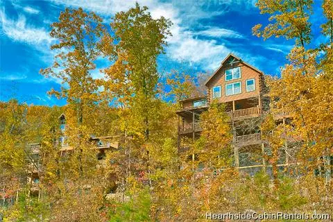 Outside view through trees of Grand View Lodge cabin in Pigeon Forge