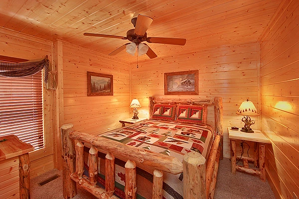 Queen bedroom inside Heavenly Heights 8 bedroom large Pigeon Forge cabin rental