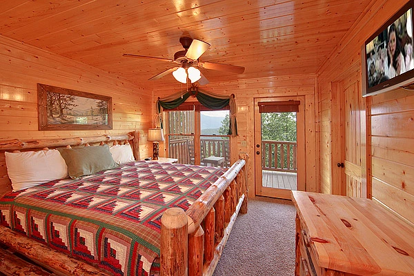 King size suite with tv at Heavenly Heights 8 bedroom cabin rental in Pigeon Forge
