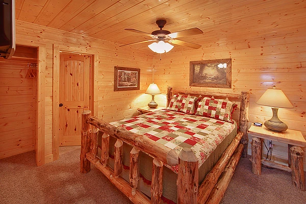 Queen size suite with private bath at Heavenly Heights 8 bedroom cabin rental in Pigeon Forge