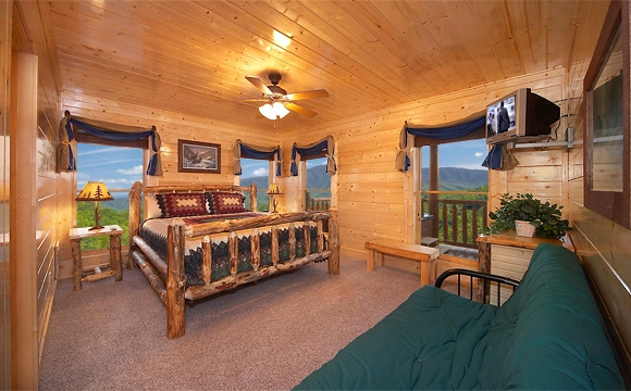 King-size bedroom that overlooks the mountains in Majestic View Lodge cabin in Pigeon Forge