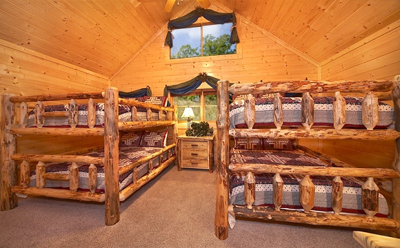 Two sets of queen-size bunk beds in Majestic View Lodge cabin in Pigeon Forge