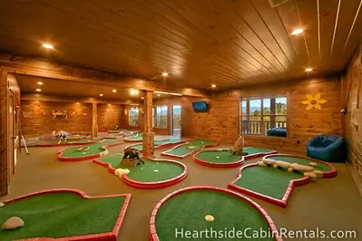 18 hole mini golf course inside Mountain Top Retreat cabin in Pigeon Forge.