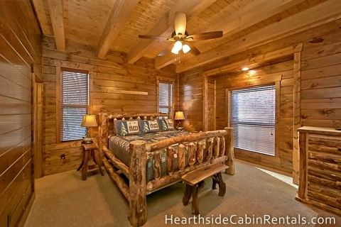 Comfortable king-size bed inside large 8 bedroom cabin in Pigeon Forge